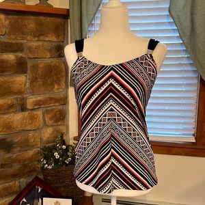 White House black market top with metal accents